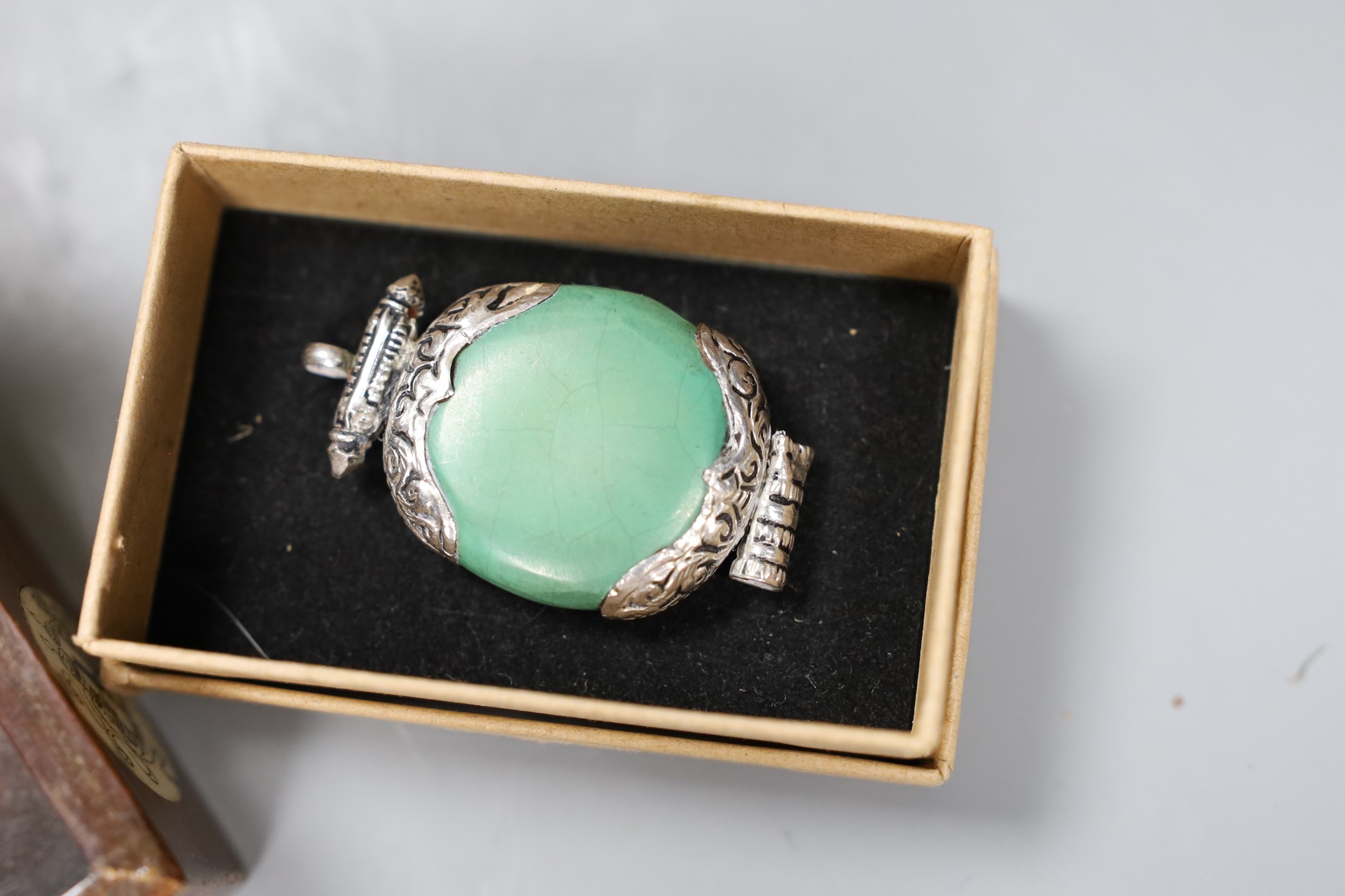 A Chinese enamel on brass stamp box, a Tibetan amulet, an agate bead rosary and a bone inlaid box and cove(4), Enamel box, 11 cms x 3.5cms high
